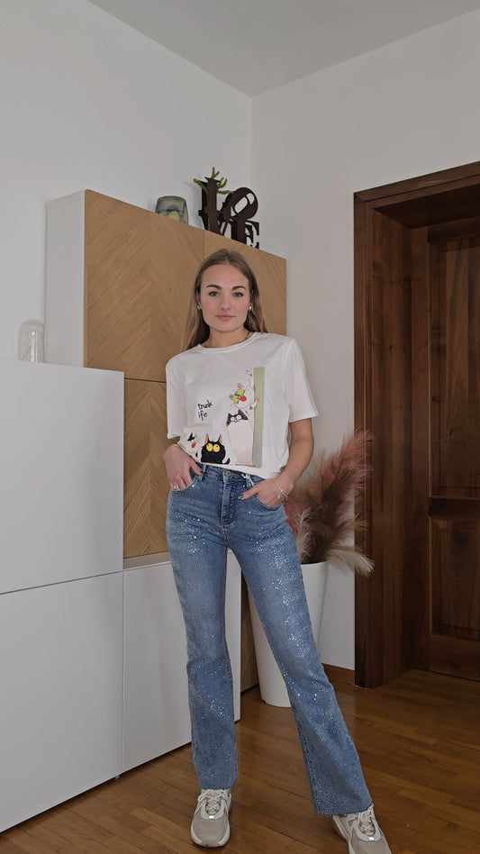 Jeans con brillantini applicati elasticizzati
