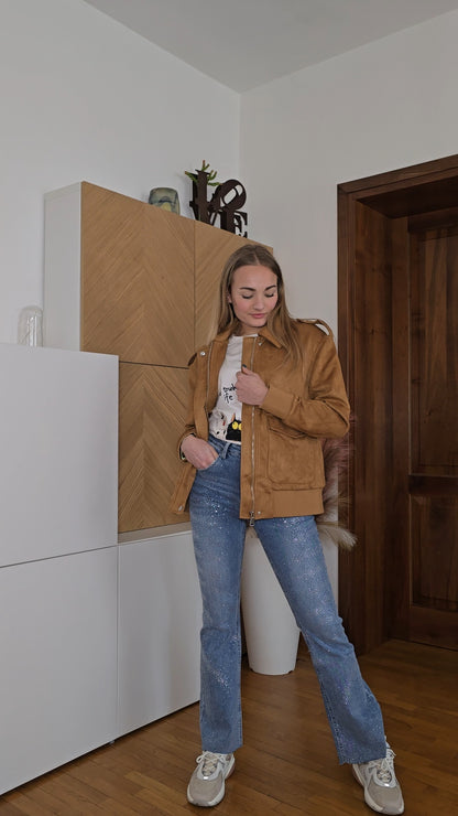 Jeans con brillantini applicati elasticizzati