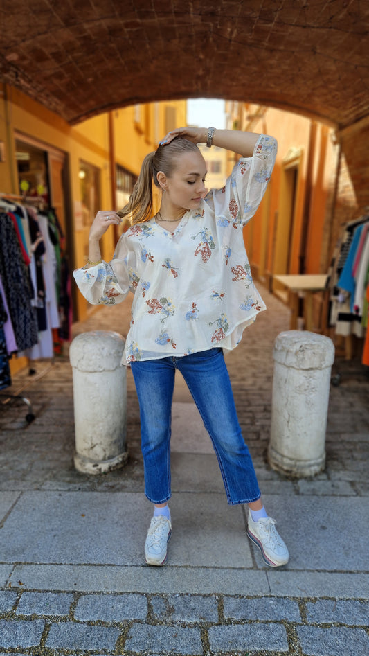 Blusa con ricami floreali